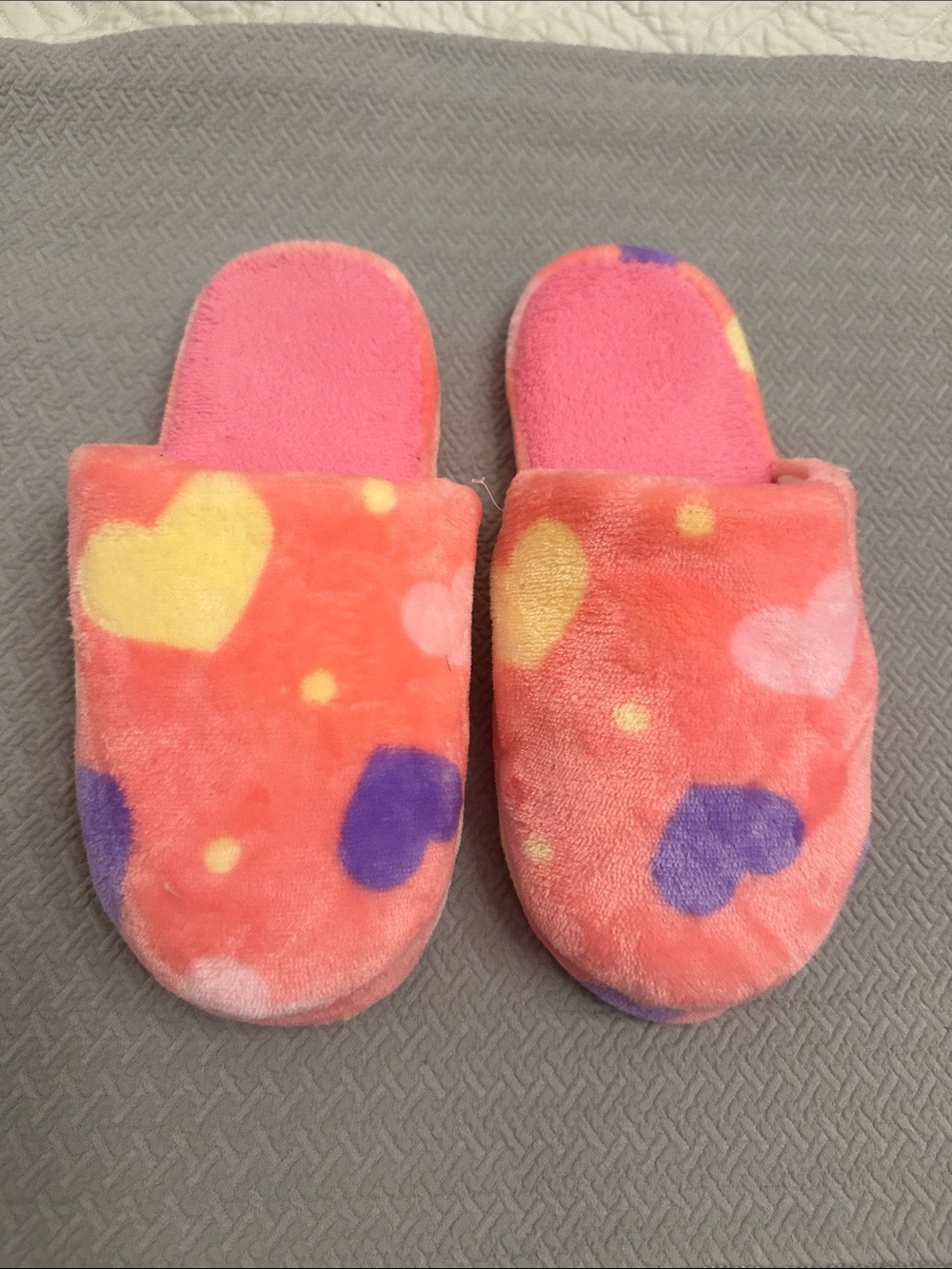 Women’s plush heart design slippers. Never worn.